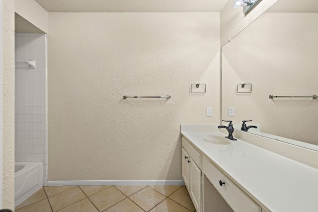 bathroom with vanity, tiled shower / bath combo, and tile patterned floors