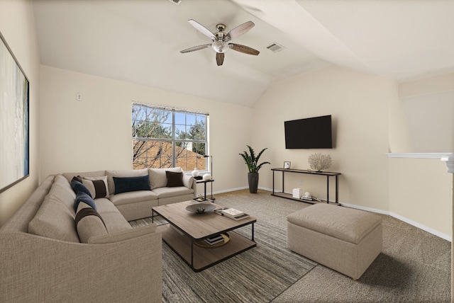 carpeted living room with ceiling fan and vaulted ceiling