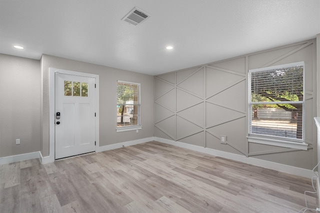 foyer with light hardwood / wood-style floors