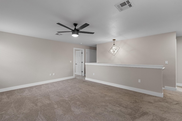 spare room with carpet flooring and ceiling fan