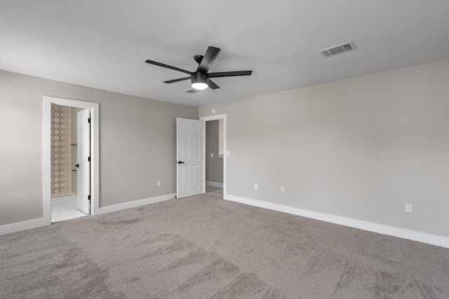 unfurnished room featuring light carpet and ceiling fan