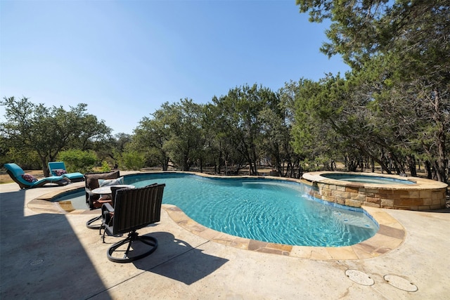 view of pool with an in ground hot tub and a patio