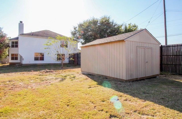 view of outbuilding featuring a yard