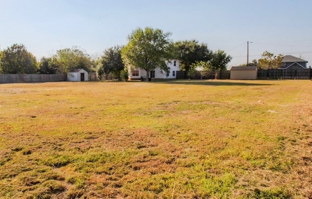 view of yard with a storage shed