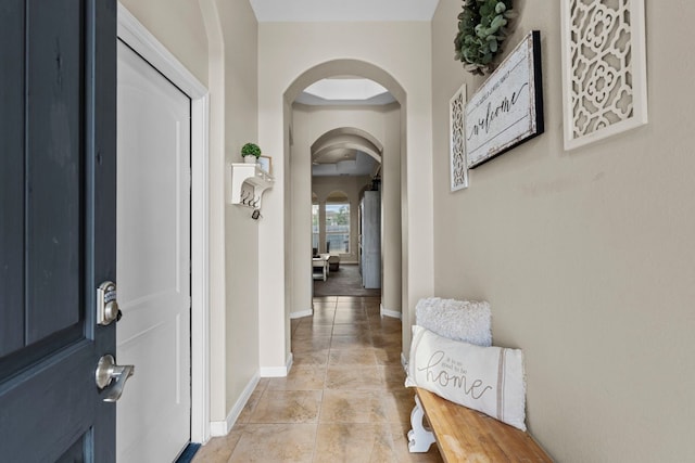 corridor with light tile patterned flooring