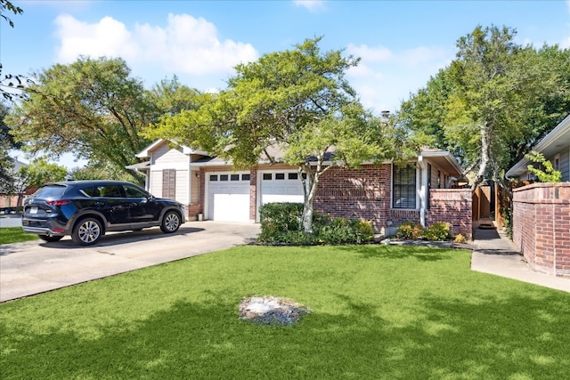 view of front of home featuring a front yard and a garage