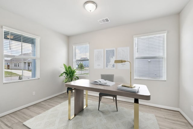 office space with light hardwood / wood-style floors