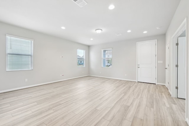 spare room with light wood-type flooring