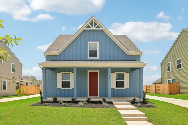 view of front of property with a porch and a front yard