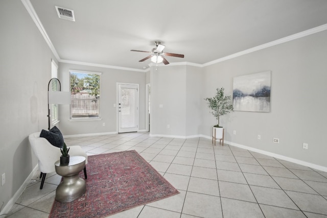 living room featuring ceiling fan, ornamental molding, and light tile patterned floors