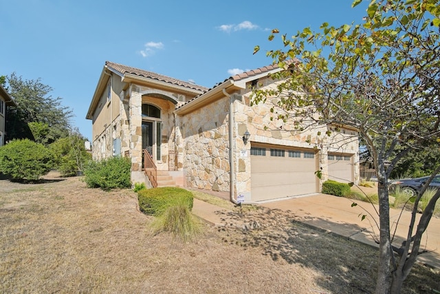 view of front of home with a garage