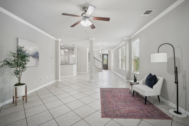 interior space with ornamental molding and ceiling fan with notable chandelier