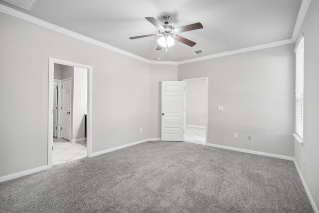 carpeted empty room with crown molding and ceiling fan