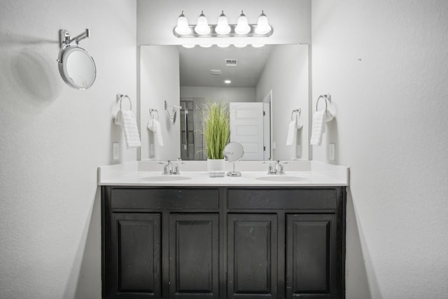 bathroom featuring vanity and walk in shower