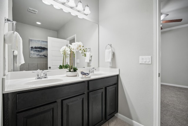 bathroom featuring vanity, ornamental molding, and ceiling fan