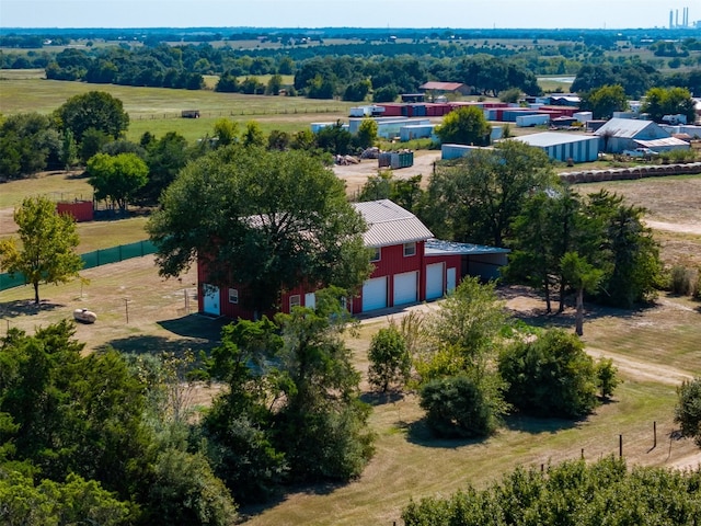 birds eye view of property with a rural view