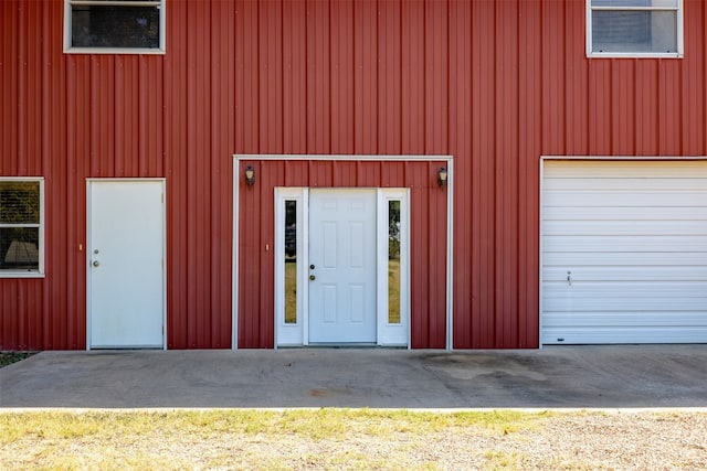 garage featuring wood walls