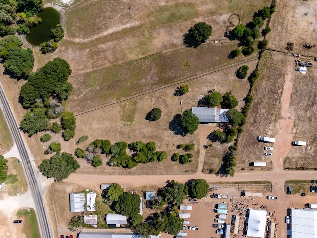 birds eye view of property with a rural view