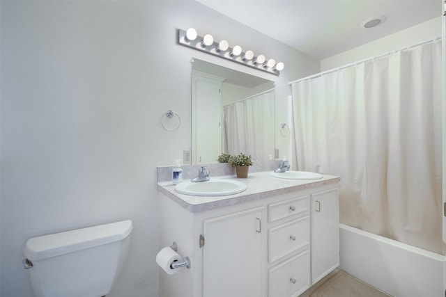 full bathroom with toilet, vanity, and shower / tub combo