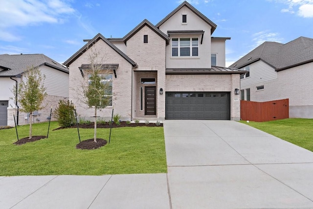 view of front of home with a garage and a front lawn