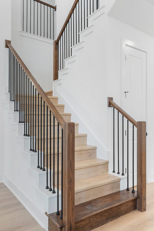 stairway with wood-type flooring