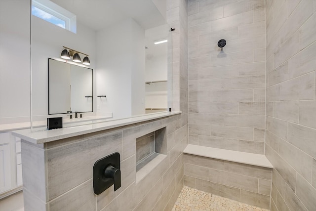 bathroom featuring a tile shower