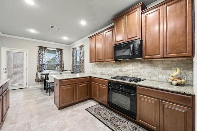 kitchen featuring kitchen peninsula, decorative backsplash, black appliances, and crown molding