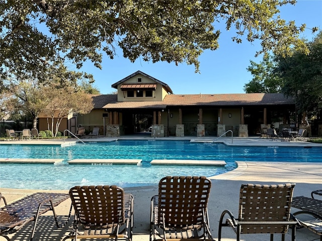 view of swimming pool with a patio area