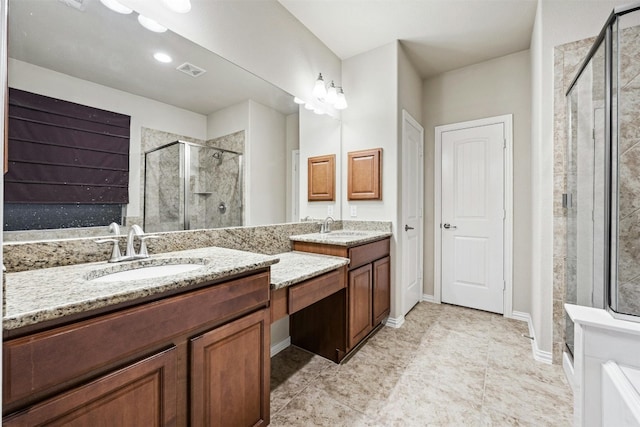 bathroom with vanity and an enclosed shower