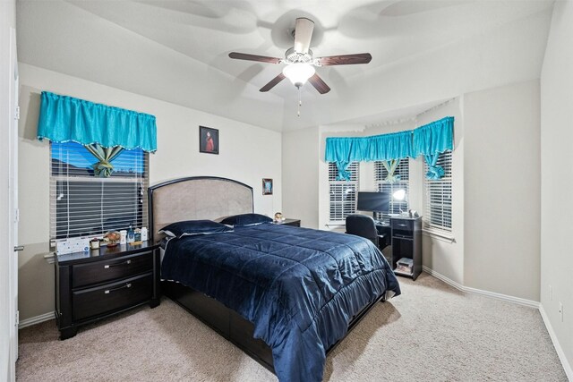 bedroom with ceiling fan and light carpet