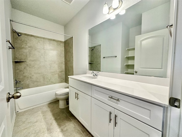 full bathroom with vanity, toilet, tile patterned floors, and tiled shower / bath