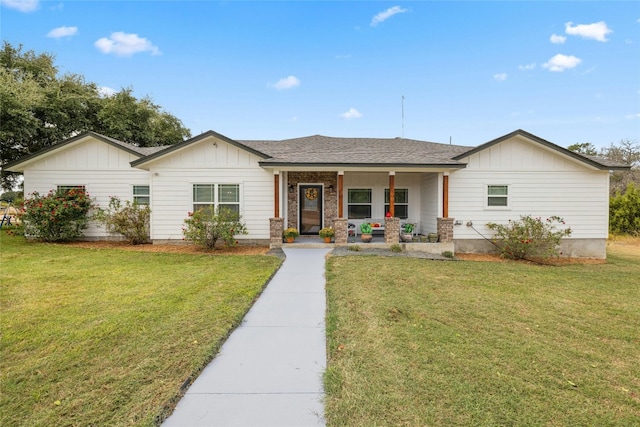 view of front of house with a front yard and a porch