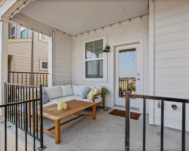 balcony featuring an outdoor living space and a patio