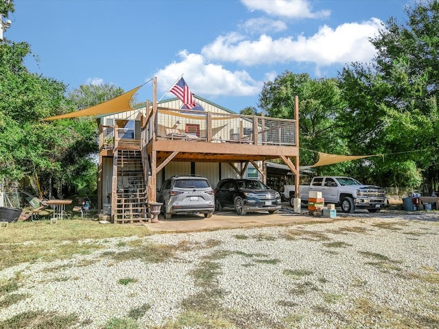 exterior space with a deck and a carport