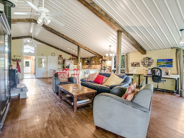 living room with beam ceiling, a healthy amount of sunlight, ceiling fan with notable chandelier, and hardwood / wood-style floors