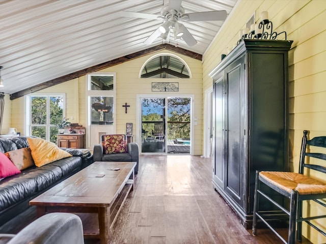 interior space with lofted ceiling and ceiling fan