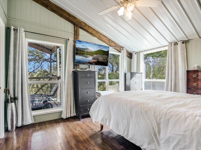 bedroom with wood walls, vaulted ceiling with beams, wood-type flooring, and ceiling fan