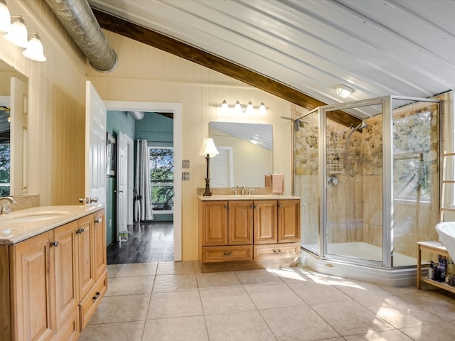 bathroom with vanity, lofted ceiling with beams, walk in shower, and tile patterned flooring