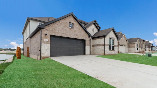 view of front of home with a front lawn and a garage