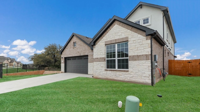 view of front of house with a garage and a front lawn