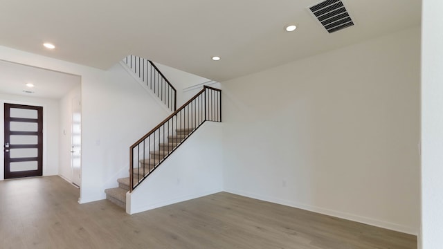 foyer entrance with wood-type flooring