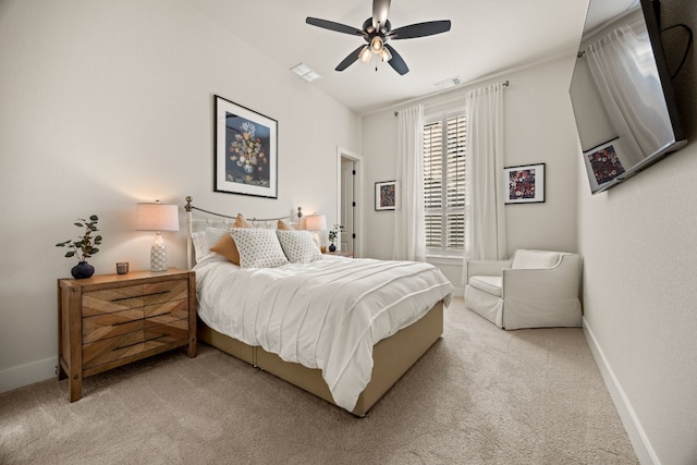 bedroom with ceiling fan and light carpet