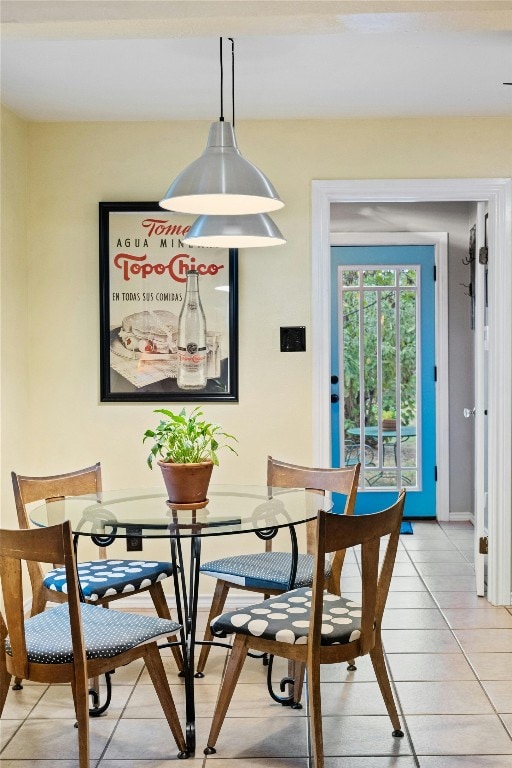 dining area featuring light tile patterned floors