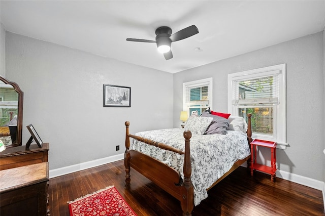 bedroom with ceiling fan, hardwood / wood-style floors, and baseboards