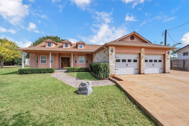 view of front of home with a front lawn and a garage