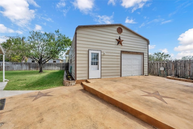 garage featuring a lawn