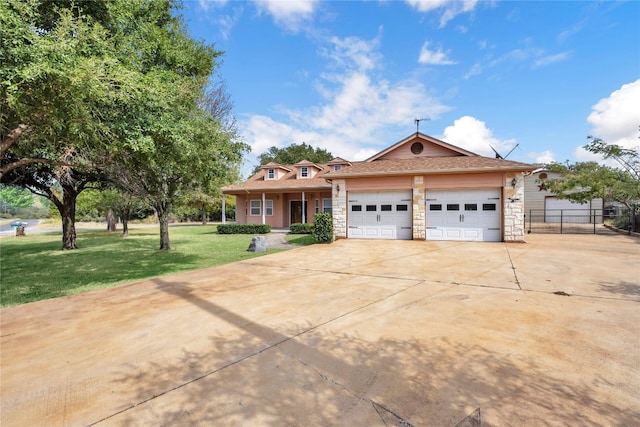 view of front of property with a garage and a front lawn