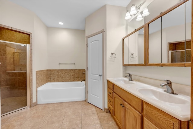 bathroom featuring vanity, independent shower and bath, and tile patterned floors