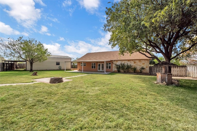 view of yard featuring a patio area and an outdoor fire pit