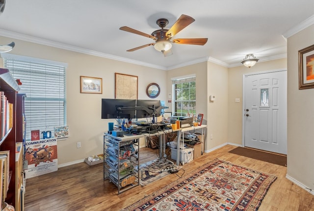 office with ceiling fan, wood-type flooring, and ornamental molding